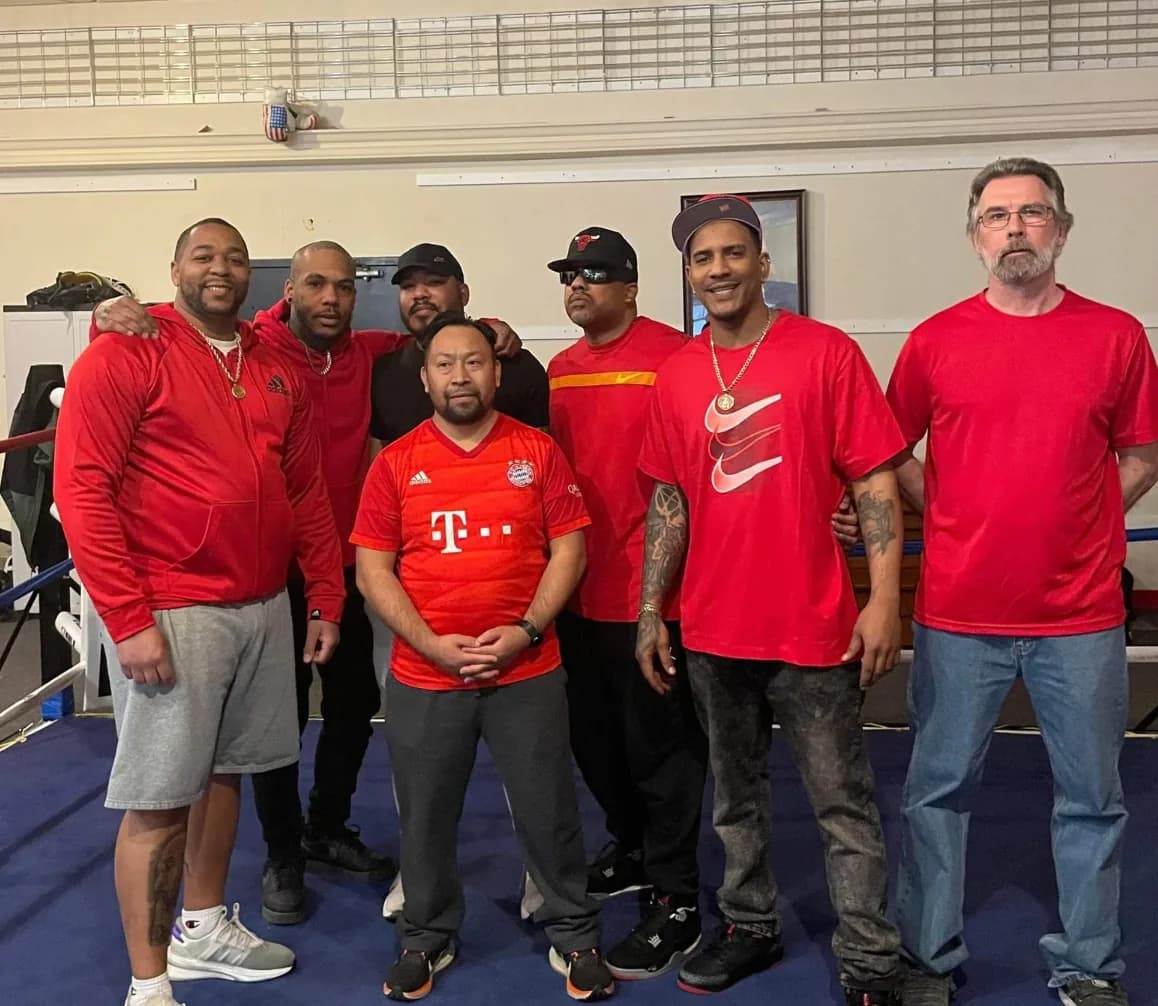 Coaches and members after a training session at Romero's Boxing School