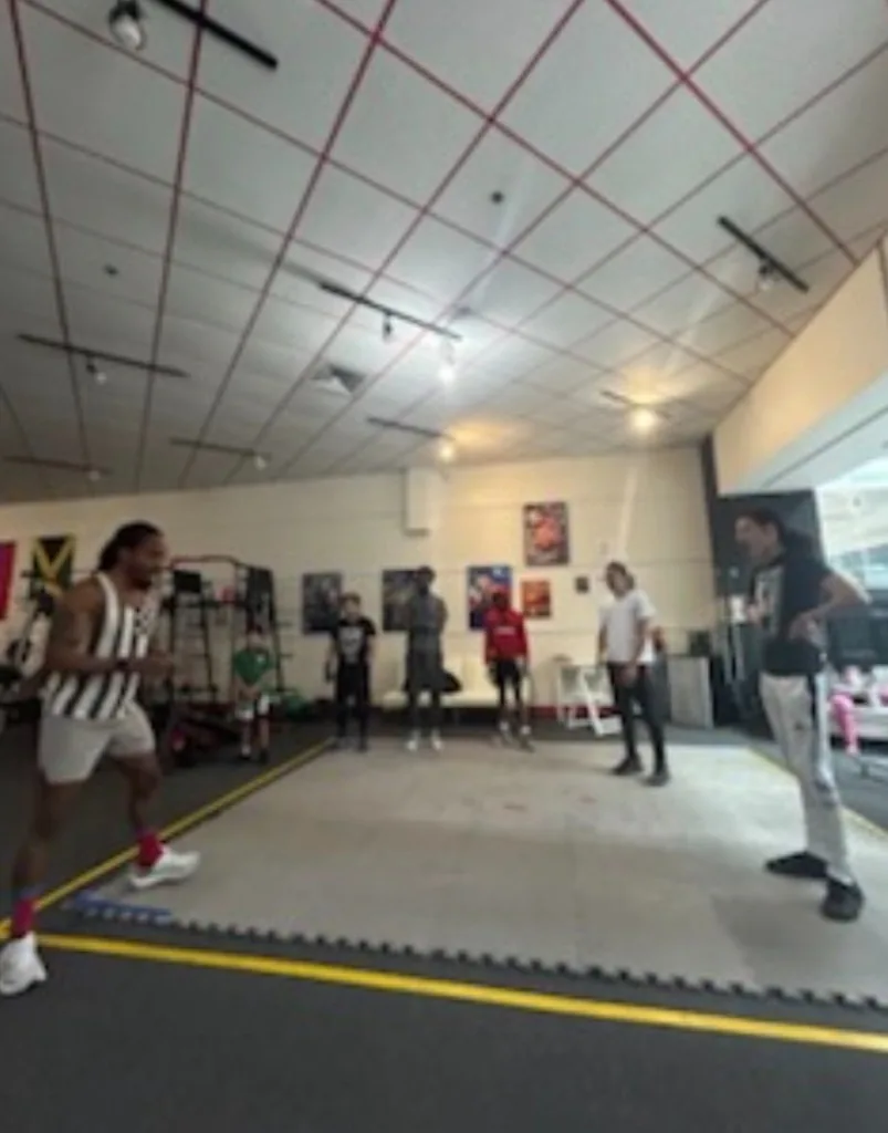 Group training drill at Romero's Boxing School